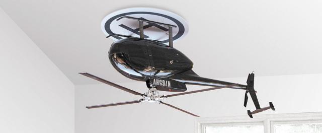 :: Helicopter gets inverted as ceiling fan ::

An inverted helicopter which functions as a ceiling fan,  delivering a cool breeze thanks to its remote controlled three speed motor.