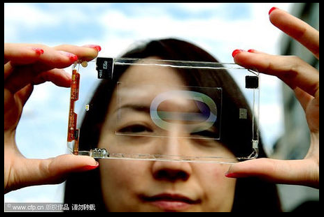 Polytron Unveils World's First Fully Transparent Smartphone

The only visible components are the board, chips, memory card and camera.

Taiwanese firm Polytron Technologies has revealed the world's first fully transparent smartphone prototype. As you can see in the pictures above and below, the prototype device is almost fully transparent. The only components visible on the device are the board, chips memory card and camera.

The rest of the device is a piece of glass that sports a small touchscreen (also transparent) located in the center of the device. According to Polytron, its technology may be available by the end of 2013.